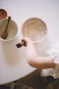 child arm mixing ingredients