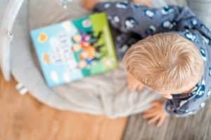 toddler looking at book