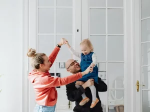 Family in London considering the difference between a live-in and live-out nanny for their household.