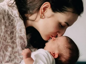 New mother recovering after birth in a calm home environment in London with professional childcare support