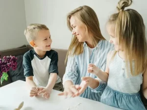 Working mother in London focusing on her career while a professional nanny supports childcare at home
