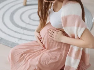Expecting mother in London thinking about childcare during pregnancy with Fox and Cubs nanny agency