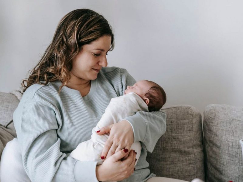 woman cradling a baby