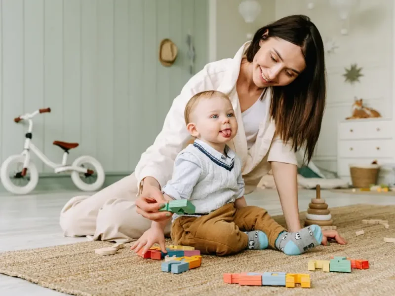Live-in nanny managing the morning routine with children in a London family home
