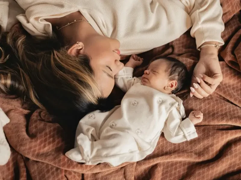 Mother spending calm time with her baby at home, supported by professional childcare in London